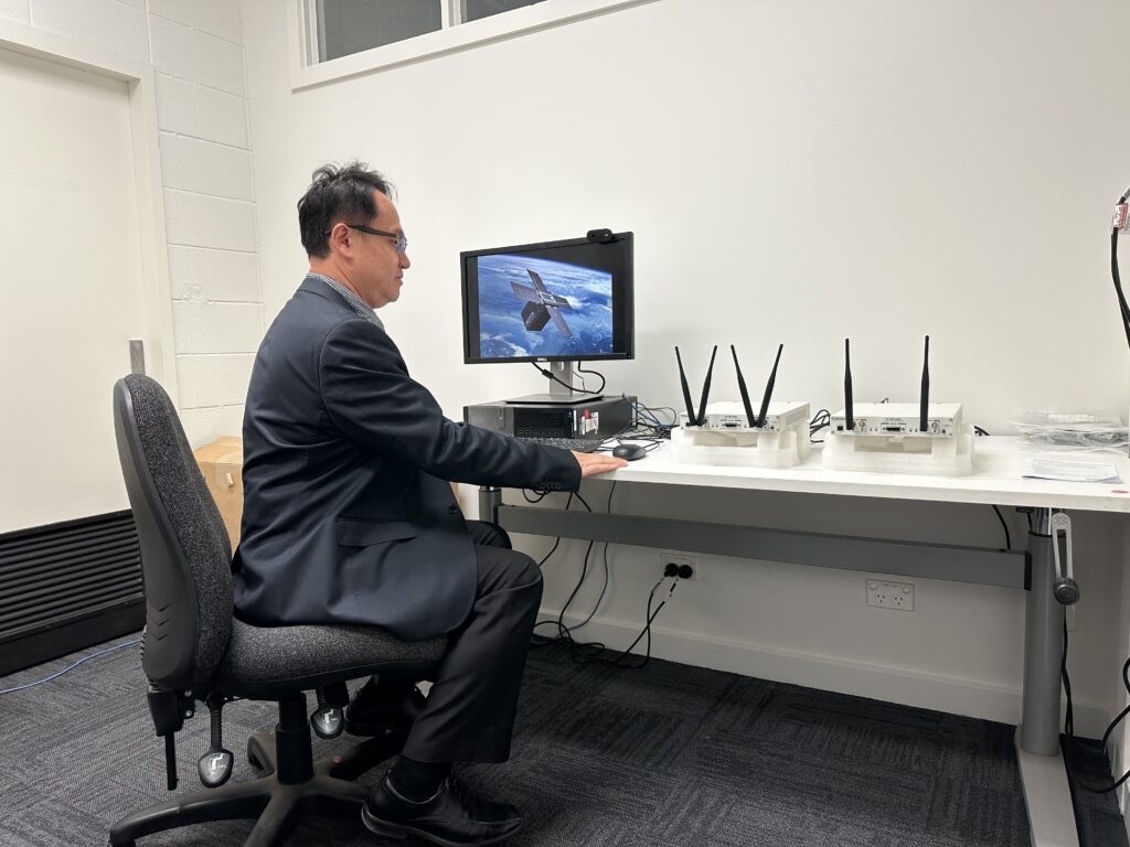 Associate Professor Nan Yang with technology